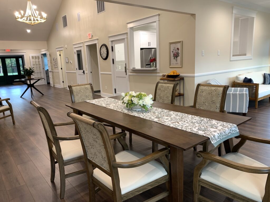 Glen Haven Huntersville assisted living dining room table flowers family style dining six residents