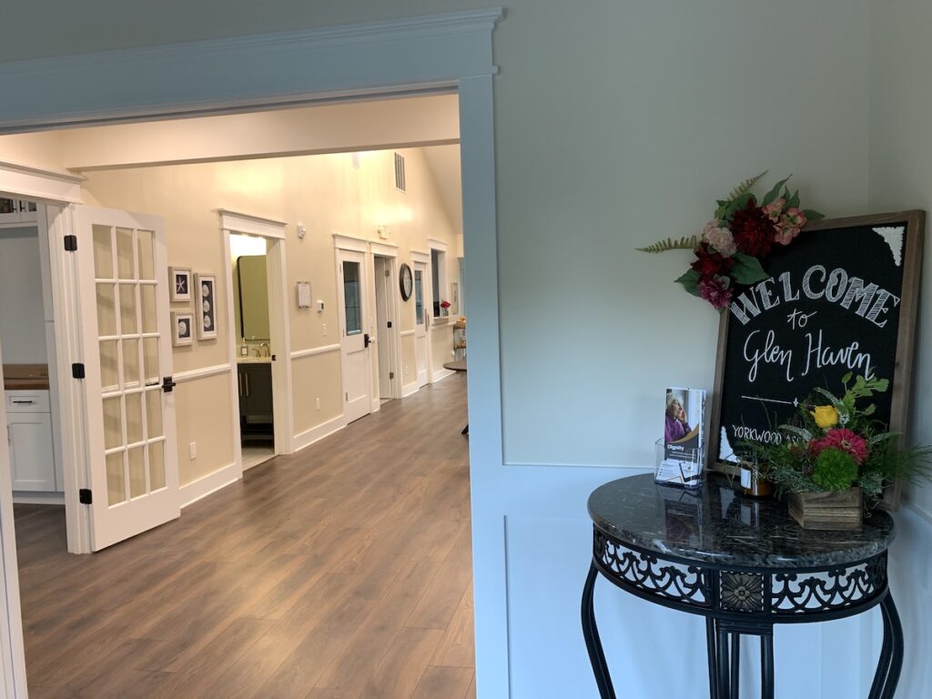 Glen Haven Huntersville assisted living foyer entrance welcome table new construction interior