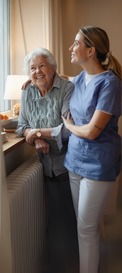 Glen Haven memory care caregiver supporting resident reminiscing dementia Alzheimer's care Lake Norman